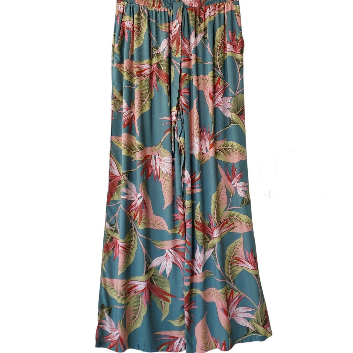 May include: Wide-leg pants with a teal background and a tropical floral pattern. The pattern includes pink, red, and green flowers and leaves. The pants have an elastic waistband and a drawstring.