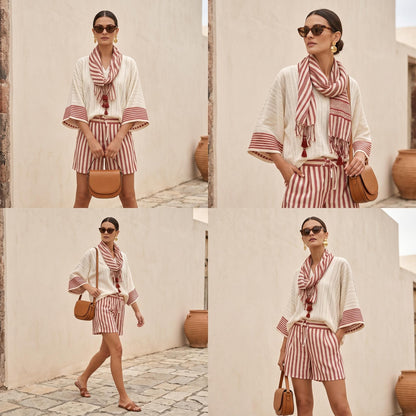 May include: A cream-colored top with wide sleeves and red striped shorts, paired with a matching red and cream striped scarf. The outfit includes a tan leather crossbody bag, dark sunglasses, and gold earrings, creating a coordinated ensemble.