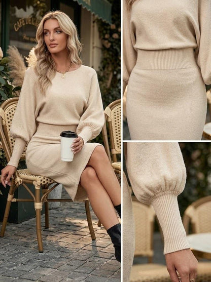 May include: A beige knit dress featuring a round neckline, long balloon sleeves with ribbed cuffs, and a wide ribbed waistband. The garment has a fitted skirt section and a relaxed bodice, crafted from a soft, solid-colored knit fabric.
